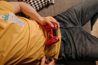 person playing video game - カプコン快進撃の秘密!新作200万本突破と業界牽引の戦略