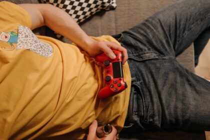 person playing video game - カプコン快進撃の秘密!新作200万本突破と業界牽引の戦略